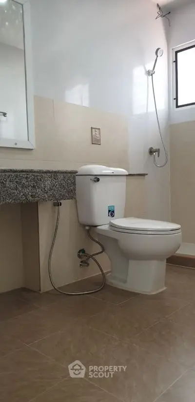 Modern bathroom with sleek fixtures and granite countertop