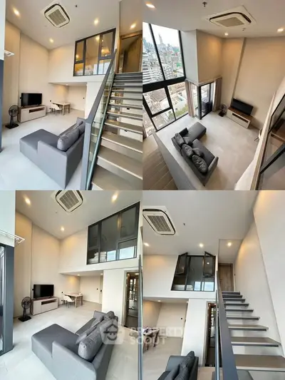 Modern loft apartment with high ceilings and large windows offering stunning city views.