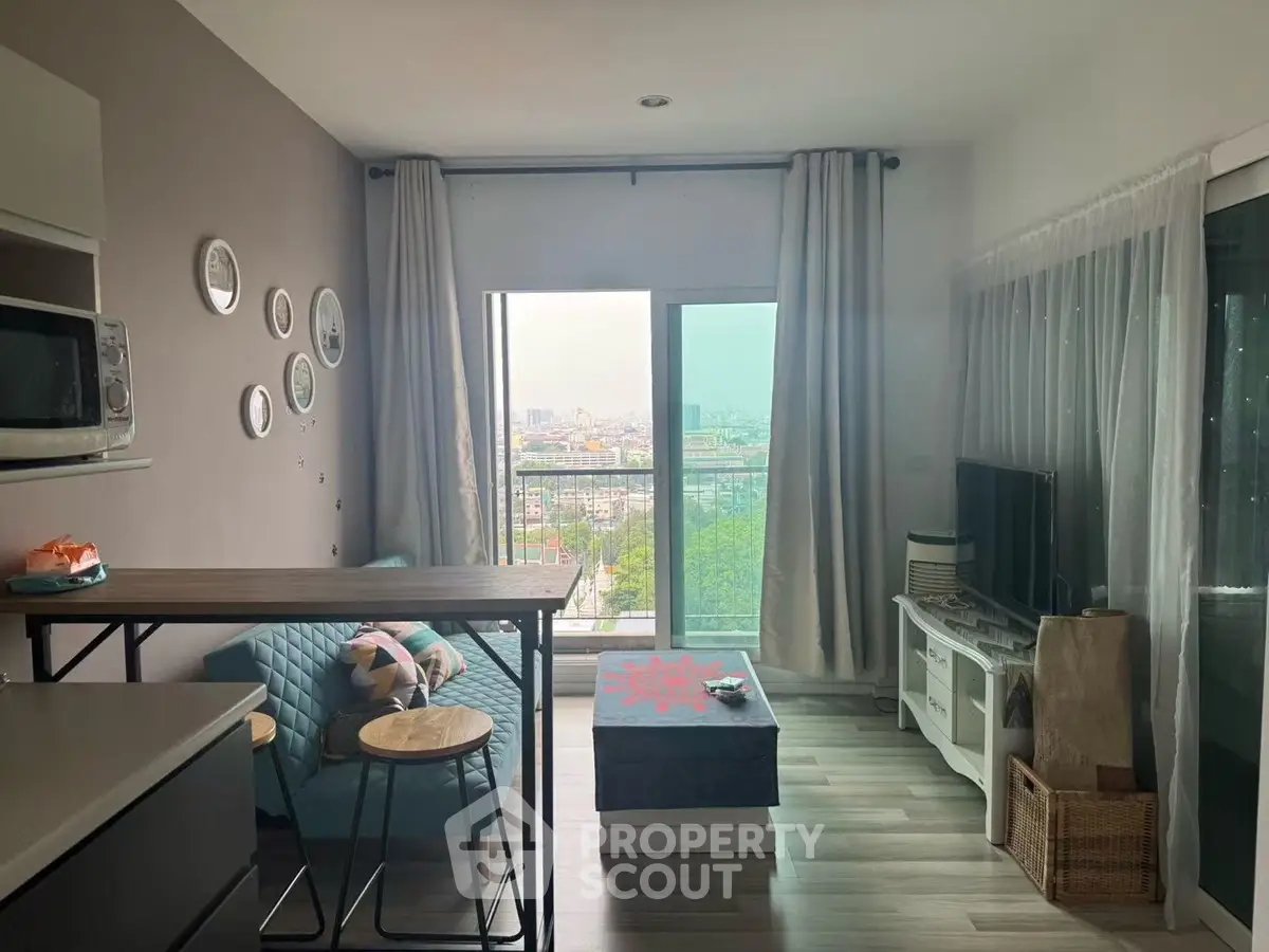 Modern living room with city view, stylish decor, and cozy seating area.