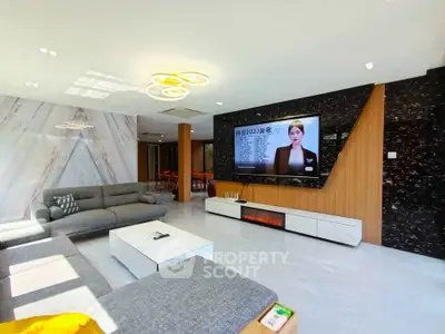 Spacious modern living room with sleek design and large TV