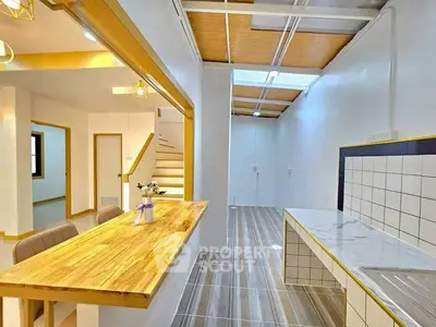 Modern kitchen with open layout and wooden accents