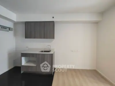 Modern minimalist kitchen with sleek cabinetry and compact design