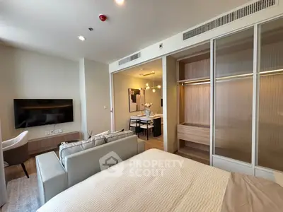 Modern studio apartment with open living area and stylish furnishings