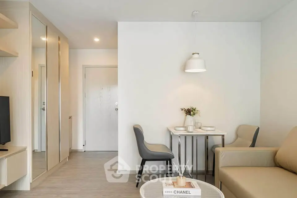 Modern living room with stylish decor and cozy dining area in a contemporary apartment.