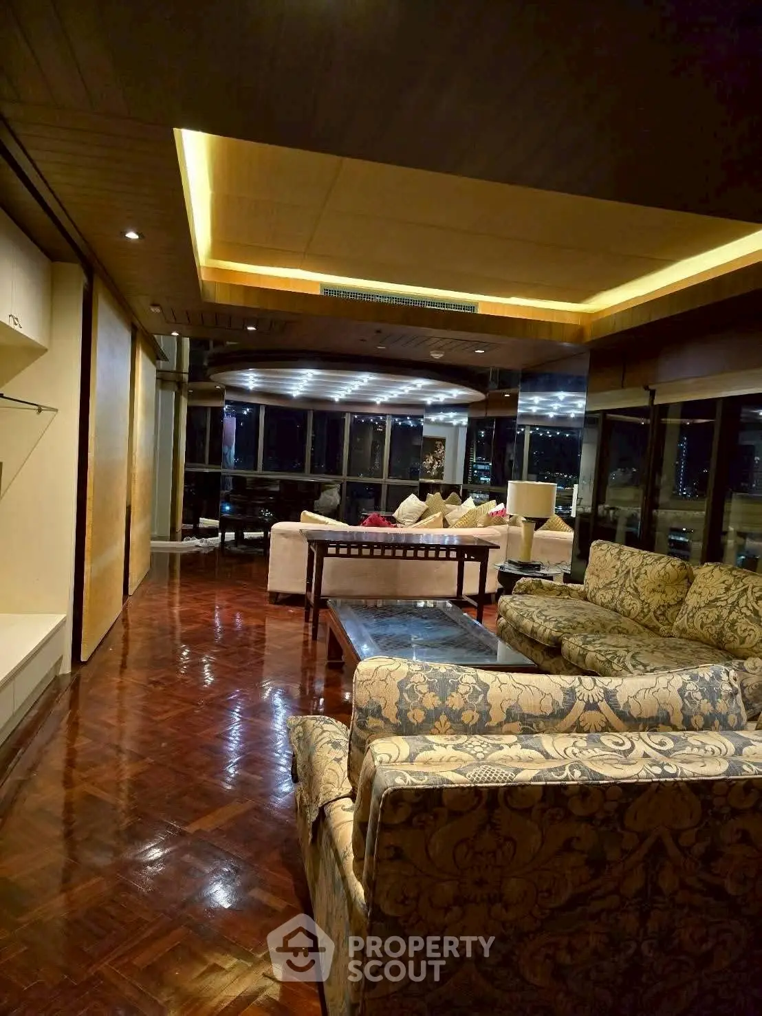 Luxurious living room with elegant furnishings and stunning city view, perfect for upscale urban living.