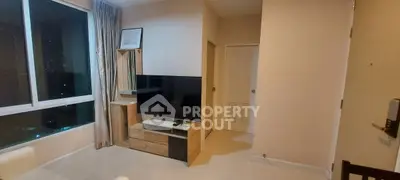 Modern living room with large window and sleek TV setup