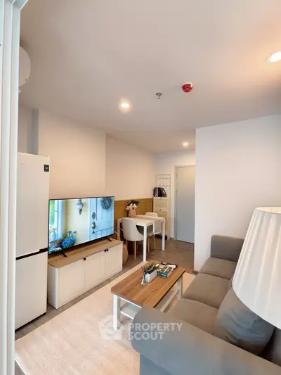 Cozy living room with modern decor and natural lighting