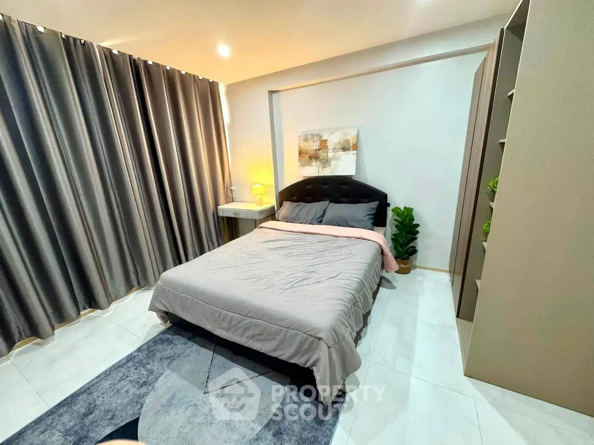 Modern bedroom with stylish decor and cozy ambiance