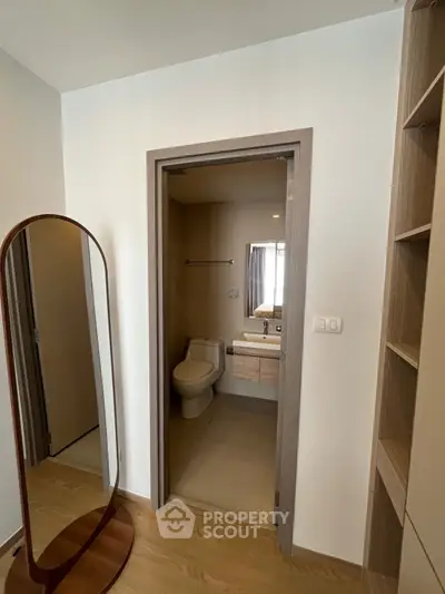 Modern apartment interior with bathroom and stylish mirror