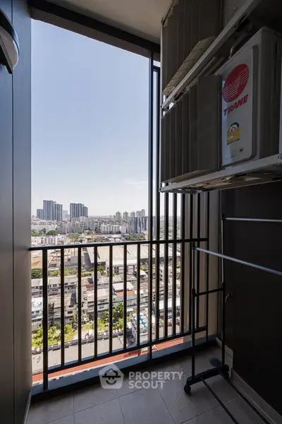 High-rise balcony with stunning cityscape view and modern amenities.