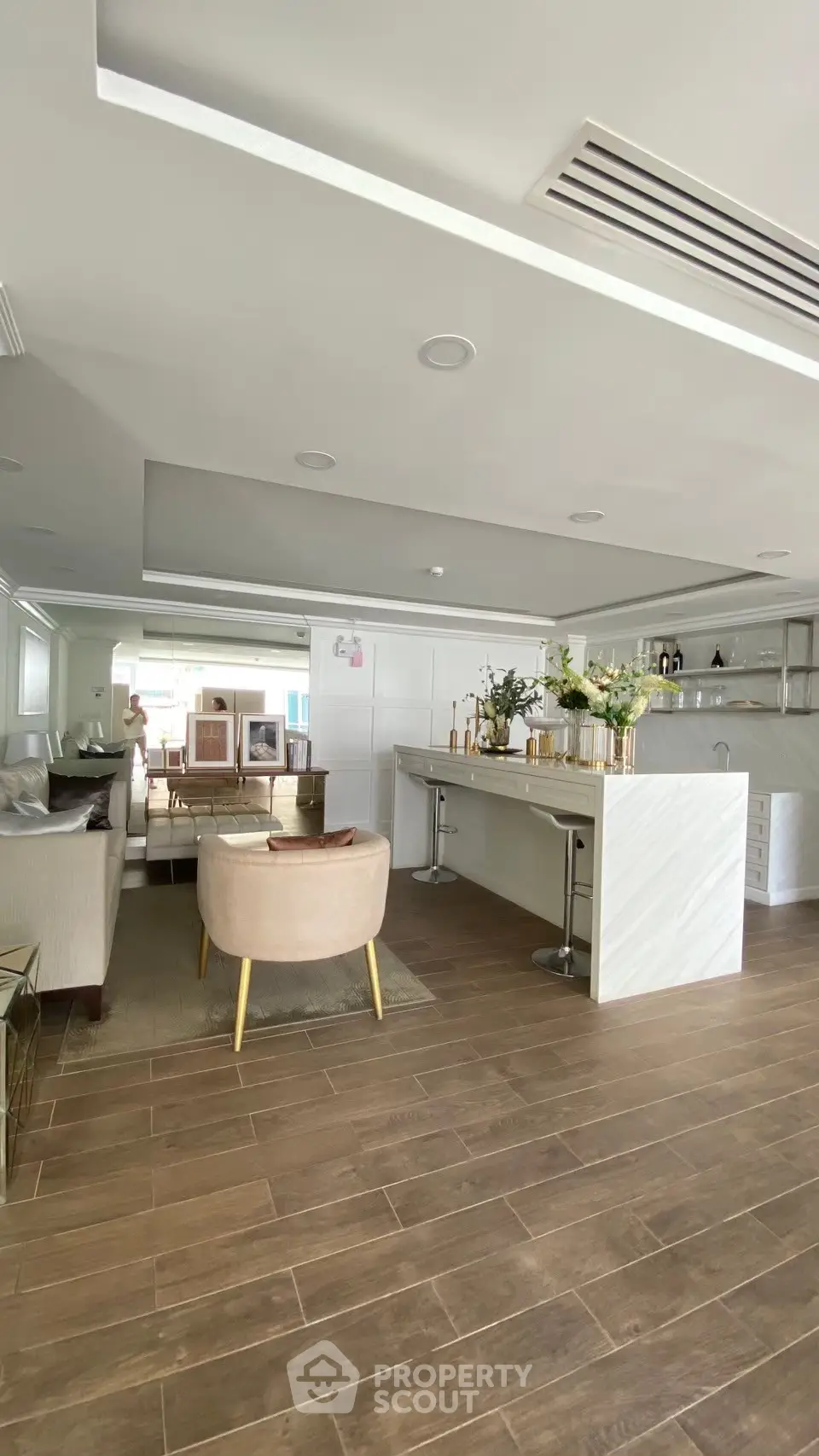 Spacious open-layout living room with modern kitchen and elegant decor