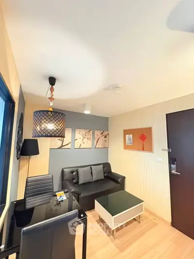 Modern living room with stylish decor and cozy seating area, perfect for relaxation.