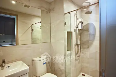 Modern bathroom with sleek shower and elegant marble tiles