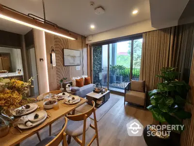 Modern living room with elegant dining area and balcony view, featuring stylish decor and natural light.