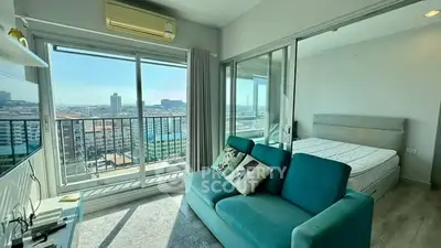 Modern apartment with stunning city view and cozy living area