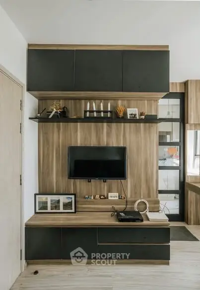 Modern living room with stylish wooden TV unit and decor