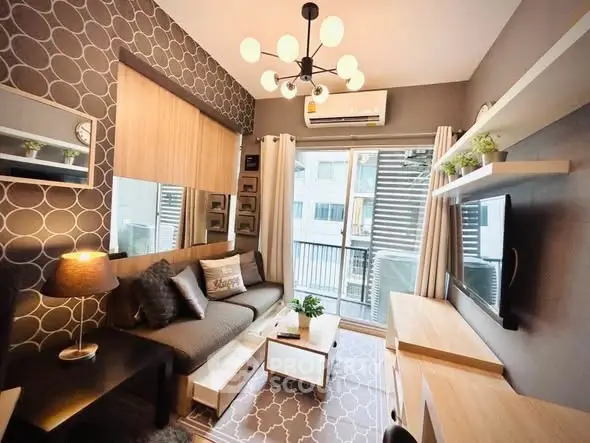 Stylish modern living room with chic decor and balcony access in urban apartment.