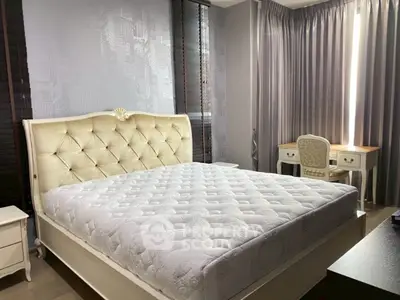 Luxurious bedroom with elegant bed and stylish desk, perfect for comfort and productivity.