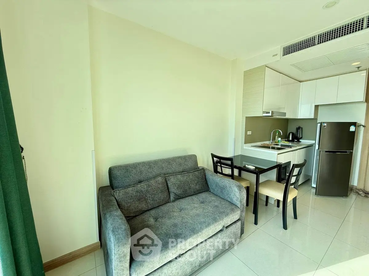 Modern compact living room with kitchenette and dining area