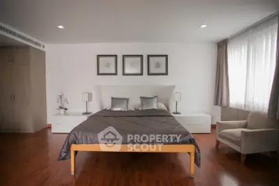 Spacious modern bedroom with elegant decor and natural light