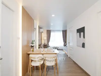 Modern open-plan living and dining area with stylish decor and natural light.