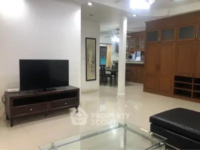 Spacious living room with modern furniture and open kitchen layout