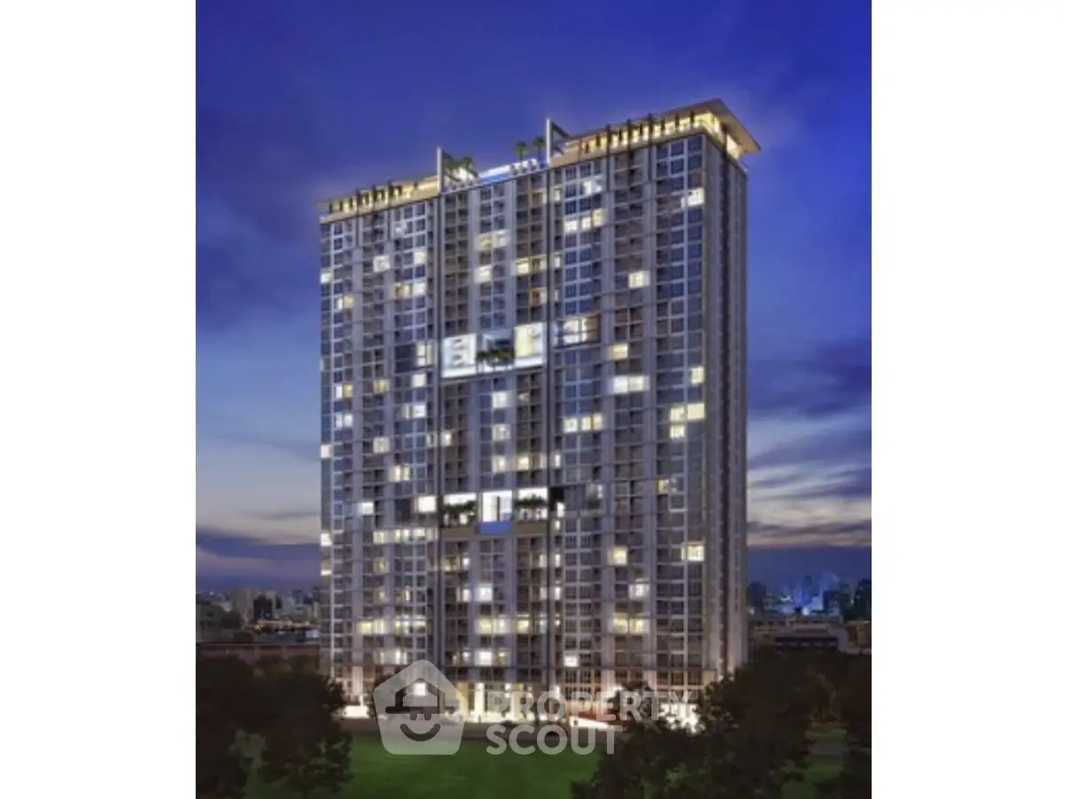 Stunning high-rise building with illuminated windows against a twilight sky, showcasing modern urban living.