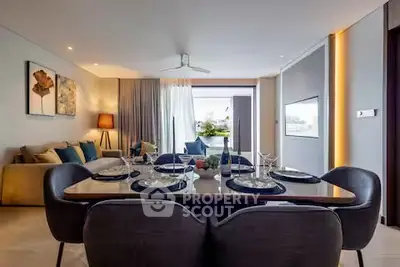 Luxurious modern living room with elegant dining area and large windows opening to a balcony.