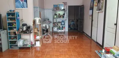 Spacious interior with tiled flooring and open shelving, ideal for versatile living space.