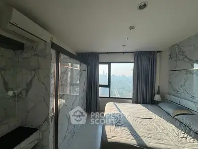 Luxurious bedroom with stunning city view and marble accents