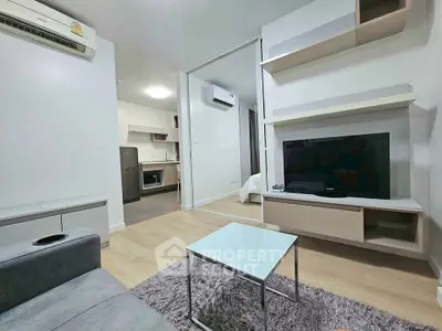 Modern living room with sleek design and open kitchen layout