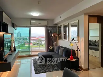 Modern living room with city view and stylish decor in high-rise apartment
