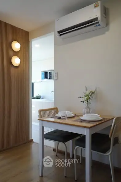 Cozy dining area with modern air conditioning and stylish decor