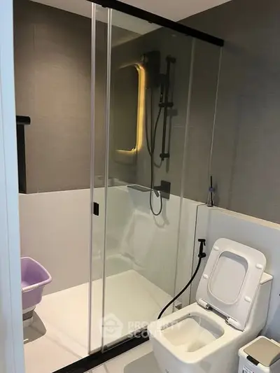 Modern bathroom with glass shower and sleek fixtures