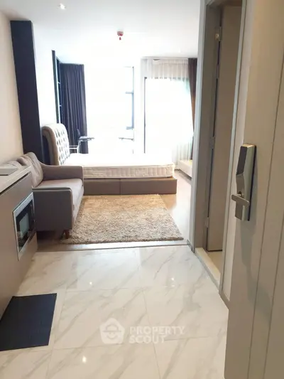 Modern studio apartment with sleek design and natural light