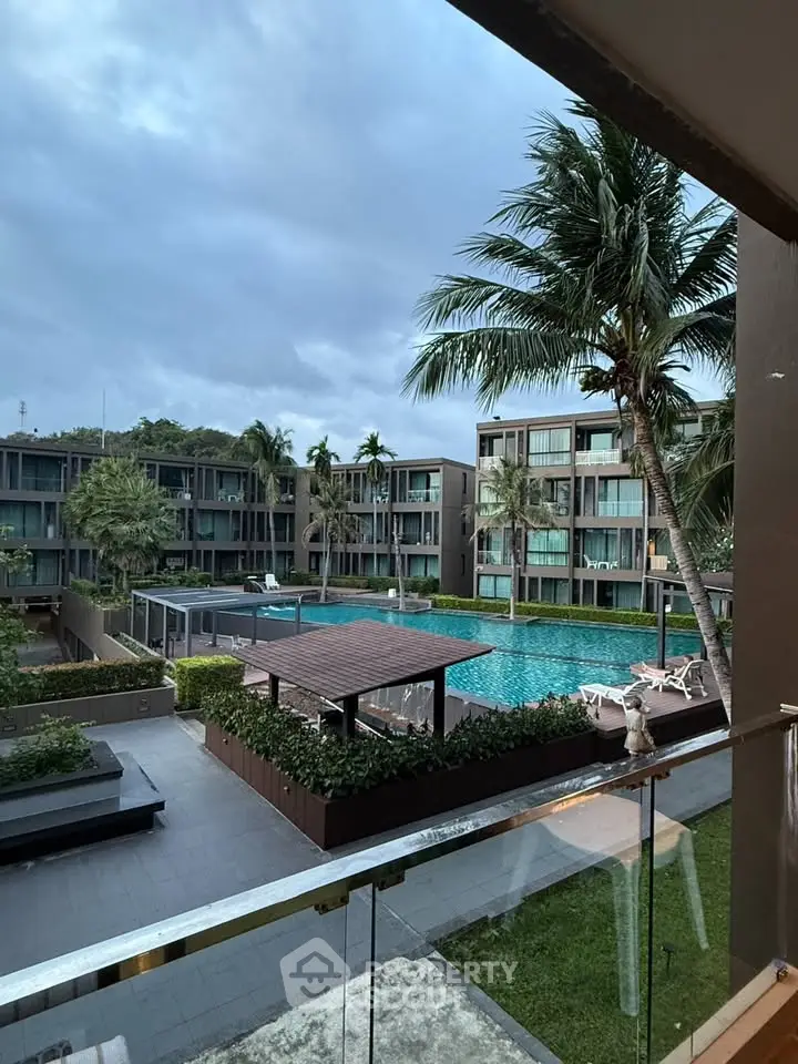 Luxurious resort-style apartment complex with pool and lush landscaping