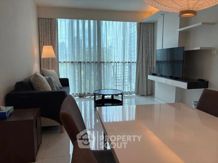 Modern living room with large windows and stylish furniture