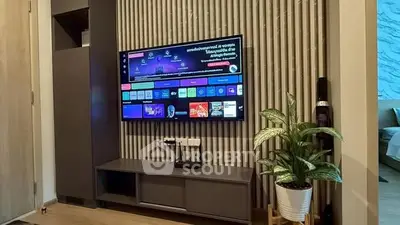 Modern living room with wall-mounted TV and stylish decor