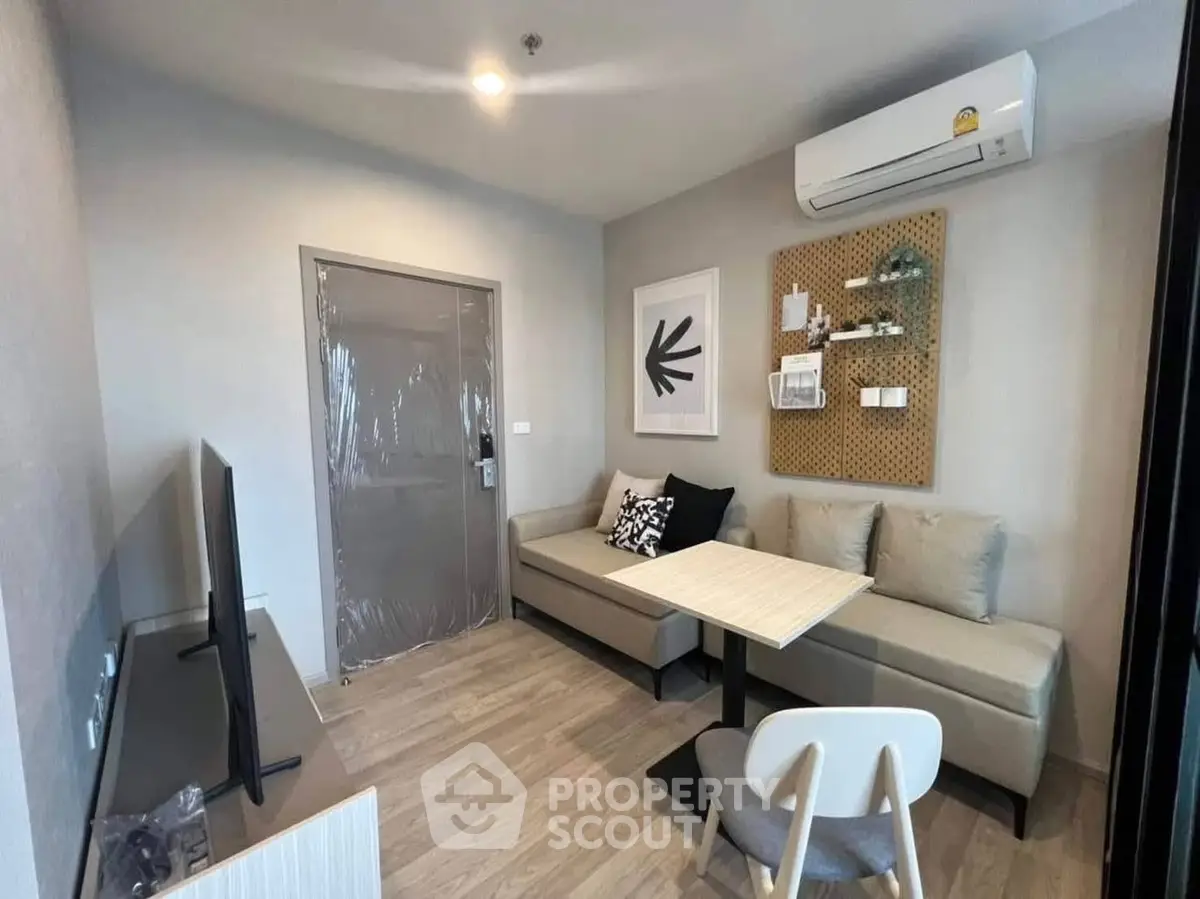 Modern living room with stylish decor and air conditioning