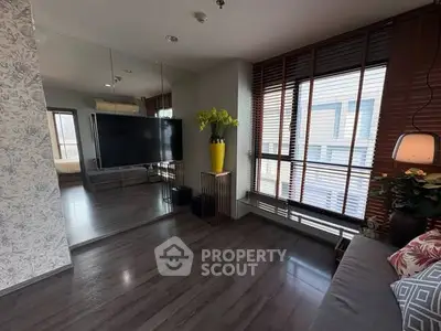 Modern living room with large windows and stylish decor