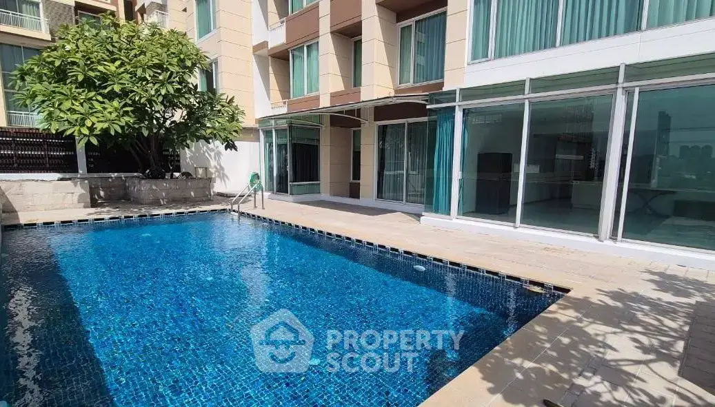 Luxurious apartment with private pool and modern glass facade, perfect for relaxation and entertainment.