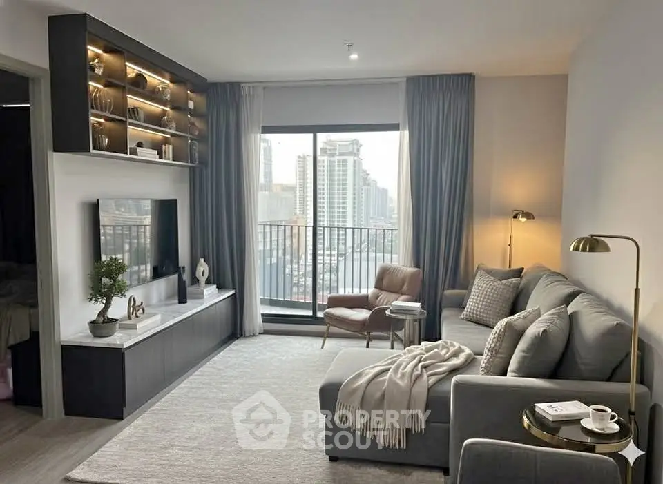 Modern living room with city view, cozy gray sofa, and stylish decor in a high-rise apartment.