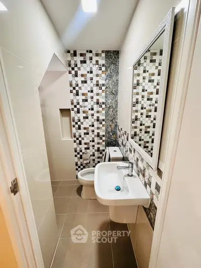 Modern bathroom with stylish tile design and sleek fixtures