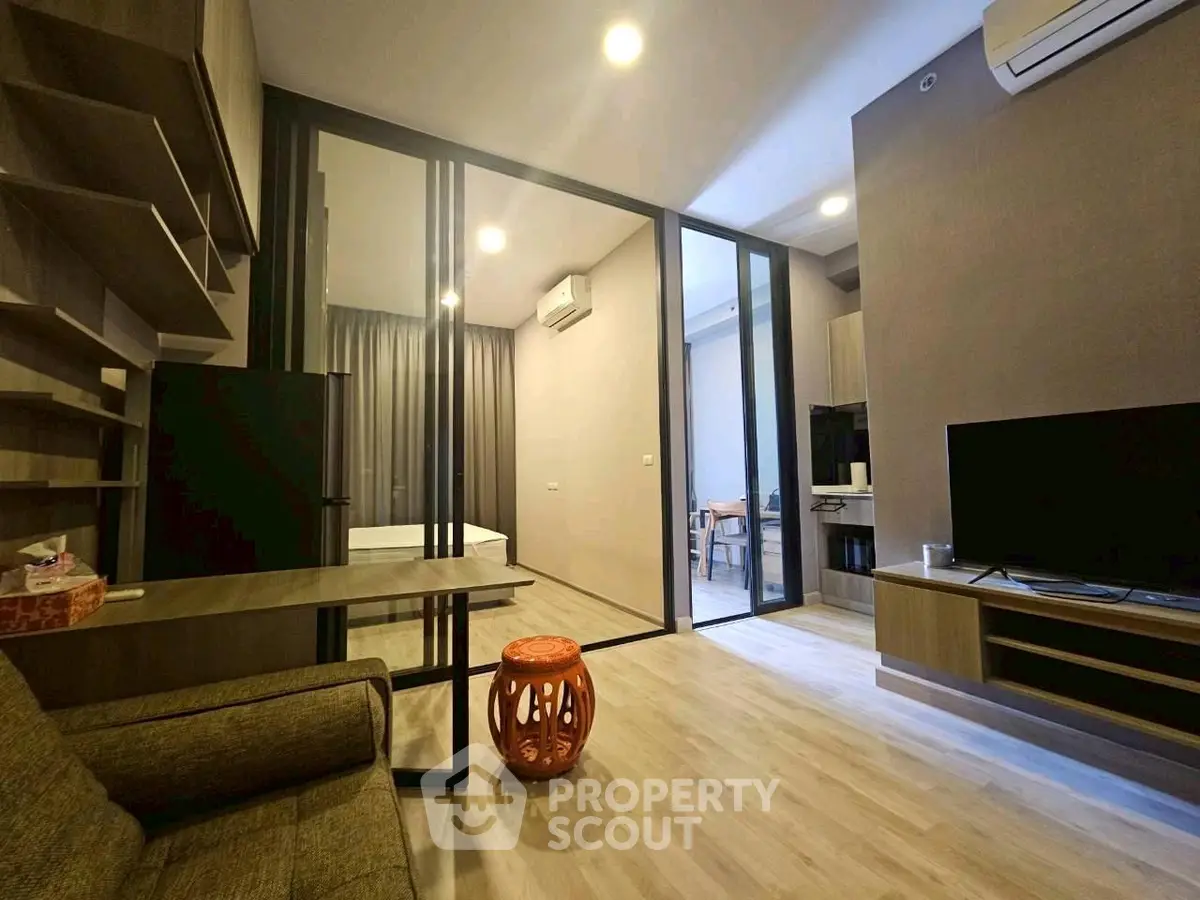 Modern living room with stylish decor and open layout in a contemporary apartment.