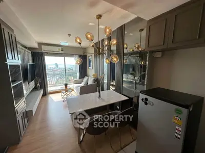 Modern living room with stylish chandelier and city view, featuring open layout and sleek furniture.