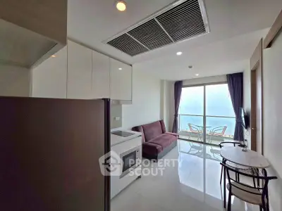 Modern apartment living room with balcony and sleek kitchen design