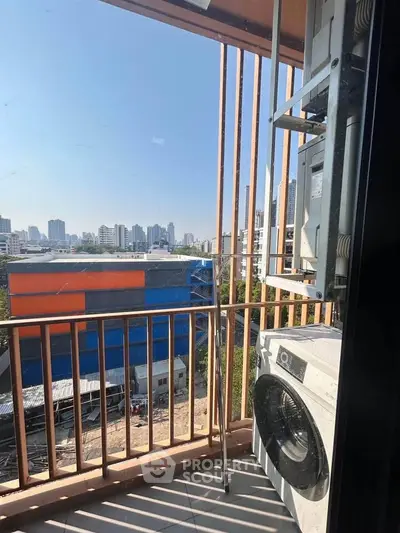 Urban balcony with city view and air conditioning unit, perfect for modern living.