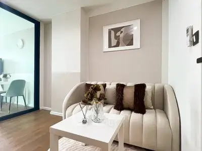 Stylish modern living room with elegant decor and cozy seating area.