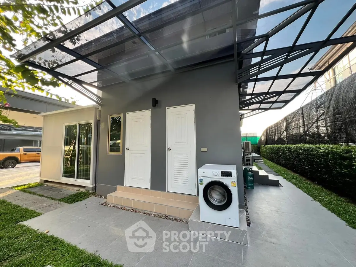 Modern exterior with washing machine and sleek design, perfect for contemporary living.