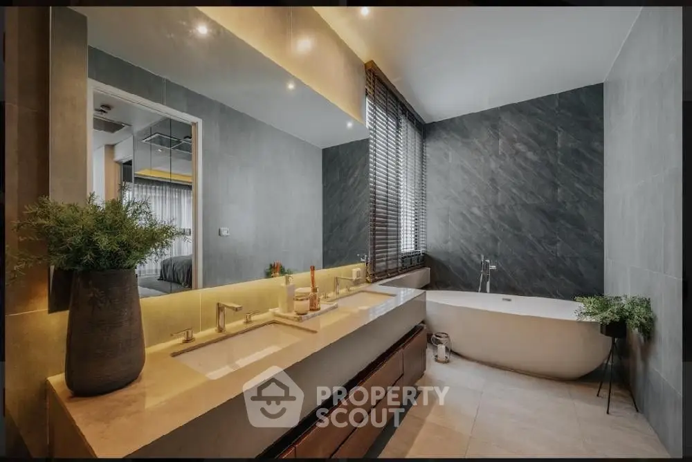Luxurious modern bathroom with dual sinks and freestanding bathtub